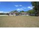 Charming single-story home with well-maintained landscaping and a spacious front yard at 9885 Se 144Th St, Summerfield, FL 34491