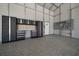Garage interior with tool storage, workspace and diamond plate flooring at 9885 Se 144Th St, Summerfield, FL 34491