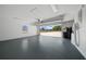 Clean, painted garage interior with a window and open door, ready for use at 9885 Se 144Th St, Summerfield, FL 34491