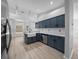 Modern kitchen boasts stainless appliances, shaker cabinets, and a breakfast bar at 9885 Se 144Th St, Summerfield, FL 34491