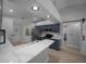 Modern kitchen features quartz countertops, stainless steel appliances, and stylish blue cabinets at 9885 Se 144Th St, Summerfield, FL 34491