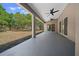 Covered patio with ceiling fans, providing a comfortable outdoor living space at 9885 Se 144Th St, Summerfield, FL 34491