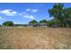 Wide shot of a single Gathering home with large lot including a garage and storage building at 9885 Se 144Th St, Summerfield, FL 34491