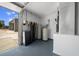 Utility room with water filtration system, hot water tank, electrical panel and grey concrete floors at 9885 Se 144Th St, Summerfield, FL 34491