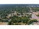 Aerial view of the neighborhood showing tree coverage, residential streets, and nearby amenities at 1039 Ne 25Th St, Ocala, FL 34470