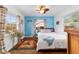 Bedroom with windows, rug, and ceiling fan at 1039 Ne 25Th St, Ocala, FL 34470