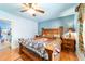 Comfortable bedroom with wood floors, ceiling fan, and wood furniture at 1039 Ne 25Th St, Ocala, FL 34470