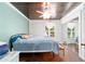 Bedroom featuring hardwood ceiling, sliding mirror door, and wooden furniture at 1039 Ne 25Th St, Ocala, FL 34470