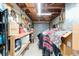 View of the garage with shelving units, pegboard, and gray garage door, perfect for storage or a workshop at 1039 Ne 25Th St, Ocala, FL 34470