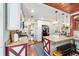 Charming kitchen showcases granite countertops, white cabinets, and unique X design on lower cabinets at 1039 Ne 25Th St, Ocala, FL 34470