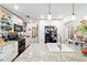 Bright kitchen with granite counters, white cabinets, pendant lighting and stainless steel appliances at 1039 Ne 25Th St, Ocala, FL 34470