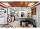Open-concept kitchen with white cabinetry, a farmhouse sink, and a breakfast bar, perfect for entertaining at 1039 Ne 25Th St, Ocala, FL 34470