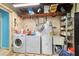 Functional laundry area with washer, dryer, water heater, and utility sink, providing convenience and practicality at 1039 Ne 25Th St, Ocala, FL 34470