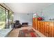 Enclosed patio featuring a small bar and an armchair at 1039 Ne 25Th St, Ocala, FL 34470