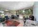 Relaxing screened porch featuring comfortable seating and an airy atmosphere, perfect for enjoying the outdoors at 1039 Ne 25Th St, Ocala, FL 34470