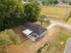 Aerial view of cozy house with a large yard, mature trees and screened porch at 10881 Sw 62Nd Avenue Rd, Ocala, FL 34476