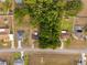 Expansive aerial view showcases neighborhood and home surrounded by mature trees at 10881 Sw 62Nd Avenue Rd, Ocala, FL 34476