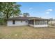 Exterior view of backyard, showcasing a screened-in patio at 10881 Sw 62Nd Avenue Rd, Ocala, FL 34476