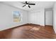 Bedroom with ceiling fan, wood floors, closet, and exterior window at 10881 Sw 62Nd Avenue Rd, Ocala, FL 34476