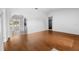 Spacious living room features pristine white walls and elegant hardwood flooring at 10881 Sw 62Nd Avenue Rd, Ocala, FL 34476