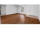 Inviting living room with wood floors, a bright window and a front door entry at 10881 Sw 62Nd Avenue Rd, Ocala, FL 34476