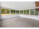Bright sun room with many windows and tiled floors at 10881 Sw 62Nd Avenue Rd, Ocala, FL 34476
