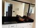 Bathroom with a vessel sink, dark countertop, and white cabinets at 11120 Sw 71St Terrace Rd, Ocala, FL 34481