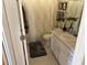 Bathroom featuring a patterned shower curtain, white vanity, and gray rug at 11120 Sw 71St Terrace Rd, Ocala, FL 34481