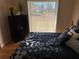 Bedroom with sliding glass doors and a view of the backyard at 11120 Sw 71St Terrace Rd, Ocala, FL 34481