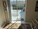 View through sliding glass doors with backyard access at 11120 Sw 71St Terrace Rd, Ocala, FL 34481