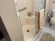 Bathroom featuring a glass-doored shower with a built-in seat at 11120 Sw 71St Terrace Rd, Ocala, FL 34481