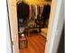 Walk-in closet with hanging rods, shelving, and a wood floor at 11120 Sw 71St Terrace Rd, Ocala, FL 34481