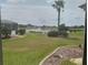 Beautiful lake view from screened in porch provides stunning backyard scenery at 12453 Se 93Rd Court Rd, Summerfield, FL 34491