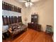 Bedroom featuring futon, window, closet, wood floors, and bookcase at 12453 Se 93Rd Court Rd, Summerfield, FL 34491