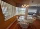 Dining Area featuring glass table, chairs, and lots of natural light at 12453 Se 93Rd Court Rd, Summerfield, FL 34491