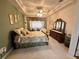 Inviting bedroom featuring a cozy bed, dresser, and soft lighting for a tranquil atmosphere at 12453 Se 93Rd Court Rd, Summerfield, FL 34491