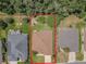 Aerial view of the property showcasing the backyard, landscaping, and neighborhood at 13196 Se 86Th Cir, Summerfield, FL 34491