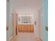 Bathroom featuring double sink vanity, tiled floor, and glass enclosed shower at 13196 Se 86Th Cir, Summerfield, FL 34491