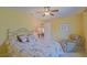 Bedroom featuring a ceiling fan, carpet, and accent pillows at 13196 Se 86Th Cir, Summerfield, FL 34491