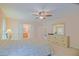 Light filled bedroom with ensuite bath, spacious dresser and neutral decor at 13196 Se 86Th Cir, Summerfield, FL 34491