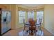 Bright breakfast nook area with large windows, cozy table and chairs set at 13196 Se 86Th Cir, Summerfield, FL 34491