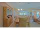 Charming dining area with wooden table and chairs, hutch, and view into the living room at 13196 Se 86Th Cir, Summerfield, FL 34491