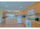 Open kitchen featuring wood cabinets and stainless steel appliances at 13196 Se 86Th Cir, Summerfield, FL 34491