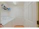 Efficient laundry room featuring a washer, dryer, shelving, and storage space for an organized cleaning area at 13196 Se 86Th Cir, Summerfield, FL 34491