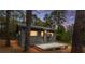 Cozy home with a rustic charm, complemented by a wooden deck and peaceful wooded backdrop at 14620 Se 47Th Loop, Ocklawaha, FL 32179