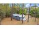 Exterior shot of a cozy home surrounded by tall trees, set in a serene environment at 14620 Se 47Th Loop, Ocklawaha, FL 32179