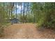 Nestled amongst towering trees, enjoy the charm of this home with a welcoming outdoor area at 14620 Se 47Th Loop, Ocklawaha, FL 32179