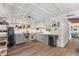 Bright kitchen with modern appliances, ample storage, light countertops, and wood-look floors at 14620 Se 47Th Loop, Ocklawaha, FL 32179