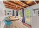 Bright living room with comfortable seating, hardwood floors, and natural light from multiple windows at 14620 Se 47Th Loop, Ocklawaha, FL 32179