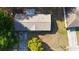 Aerial view of a single-story home with a driveway and mature trees at 16 Water Trak, Ocala, FL 34472